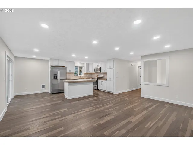 a view of kitchen view wooden floor and window