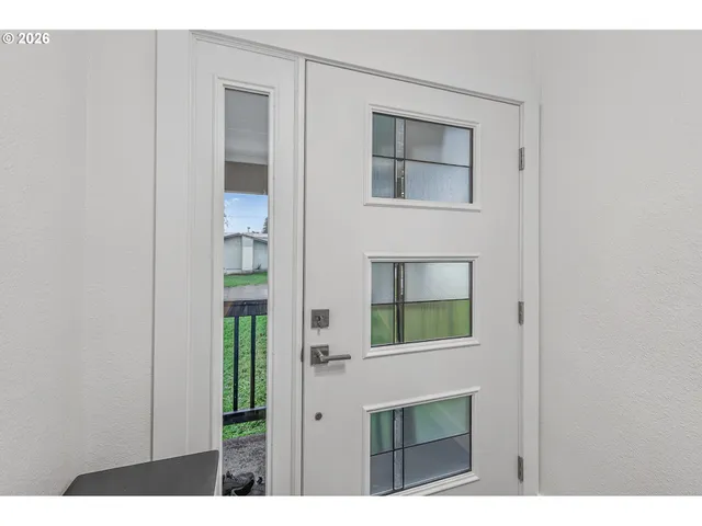 a living room with a fireplace and a window