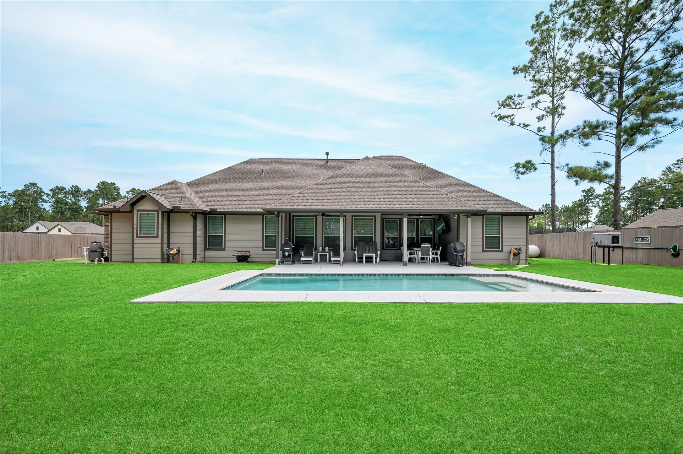 13419 Maverick Trail Road Conroe, TX 77303 - Photo 37 of 49 Back view of the home and in-ground pool.