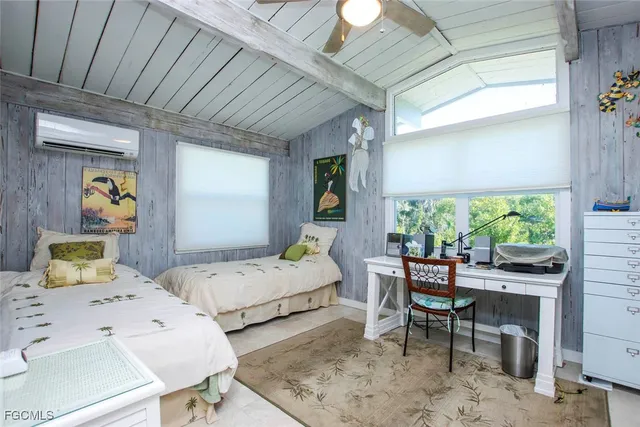 a bedroom with furniture and a window