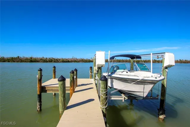 a view of a patio with a table and chairs
