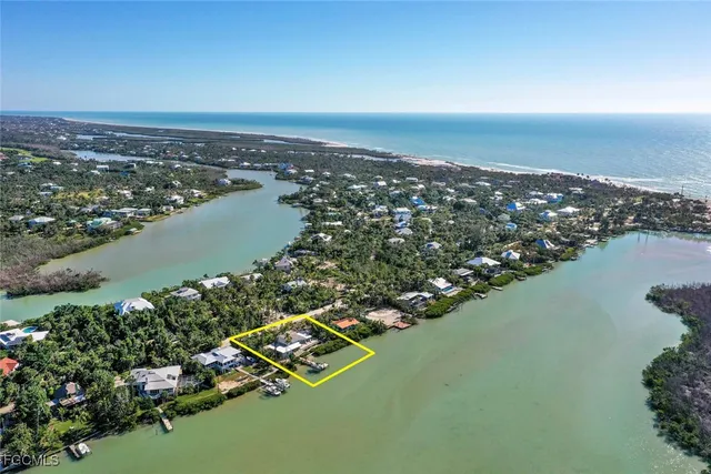 an aerial view of a city with ocean view