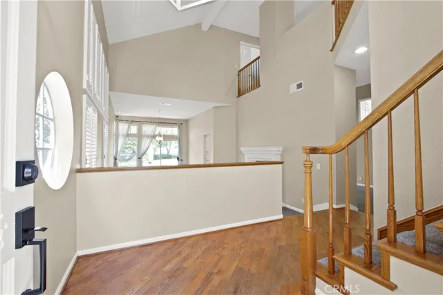 a view of an entryway with wooden floor
