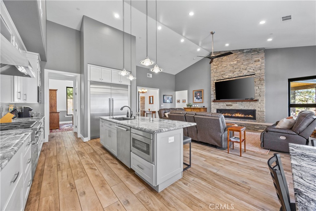 27300 Stirrup Way Tehachapi, CA 93561 - Photo 14 of 45 a large kitchen with stainless steel appliances lots of counter top space