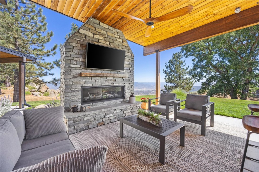 27300 Stirrup Way Tehachapi, CA 93561 - Photo 17 of 45 a outdoor living space with furniture and a flat screen tv