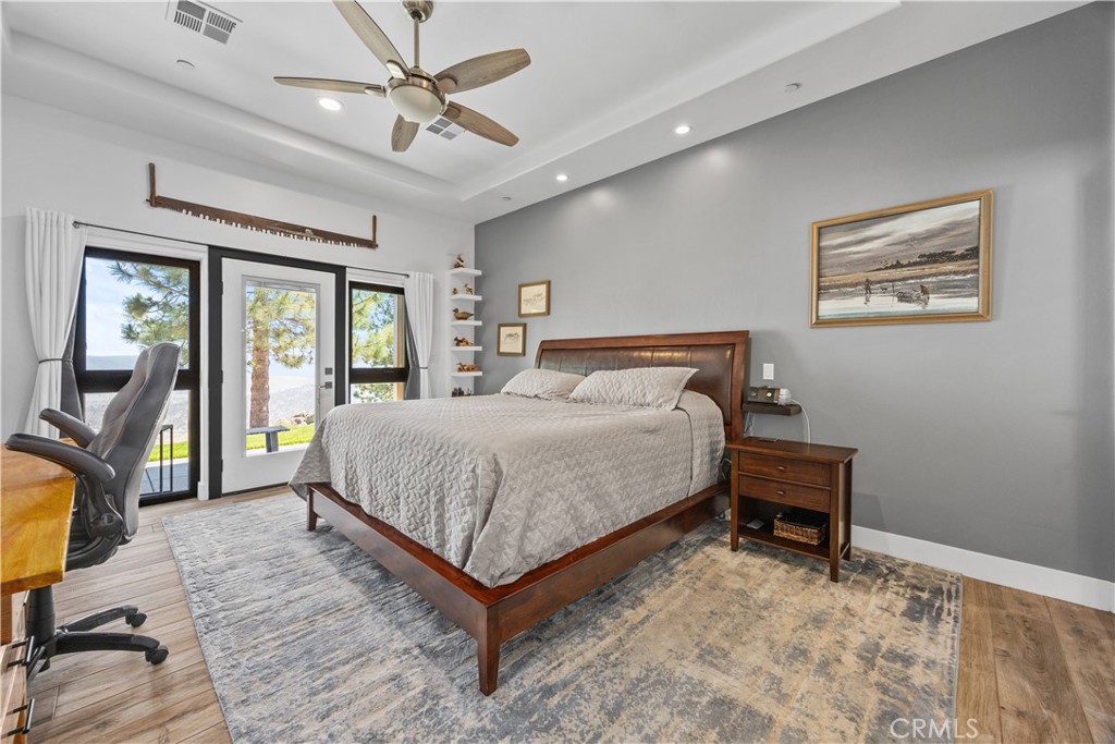 27300 Stirrup Way Tehachapi, CA 93561 - Photo 22 of 45 a bedroom with a bed a desk and chair