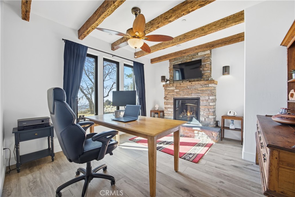 27300 Stirrup Way Tehachapi, CA 93561 - Photo 26 of 45 a view of a livingroom with furniture and a fireplace