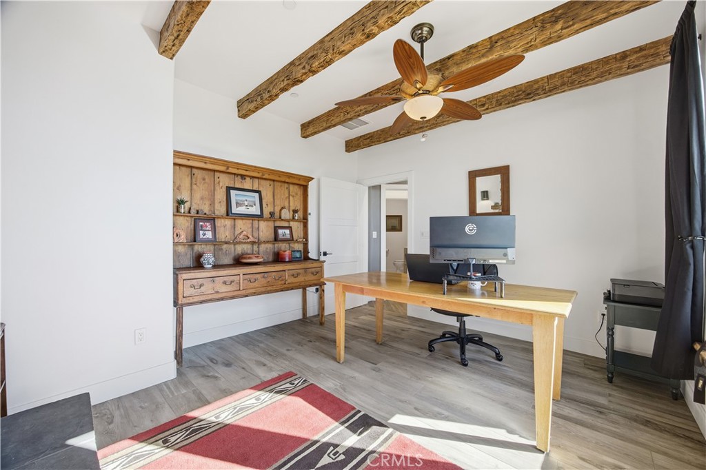 27300 Stirrup Way Tehachapi, CA 93561 - Photo 29 of 45 a living room with furniture and a wooden floor