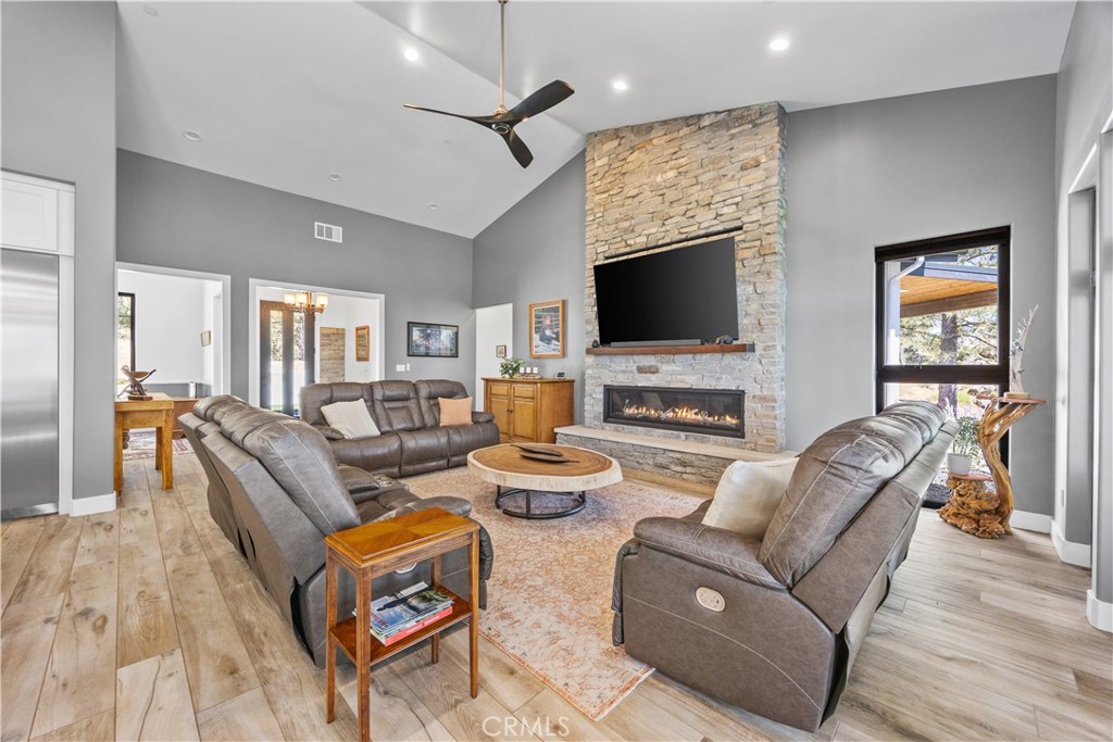 27300 Stirrup Way Tehachapi, CA 93561 - Photo 33 of 45 a living room with fireplace furniture and a flat screen tv
