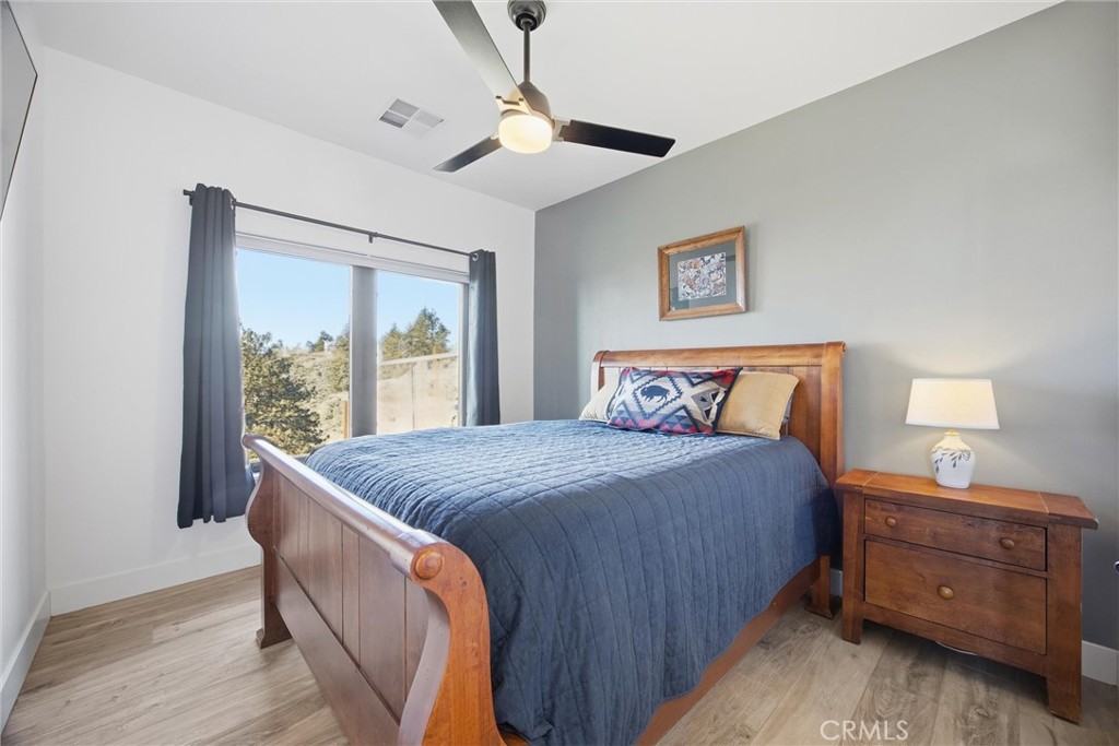 27300 Stirrup Way Tehachapi, CA 93561 - Photo 37 of 45 a bedroom with a bed and a window