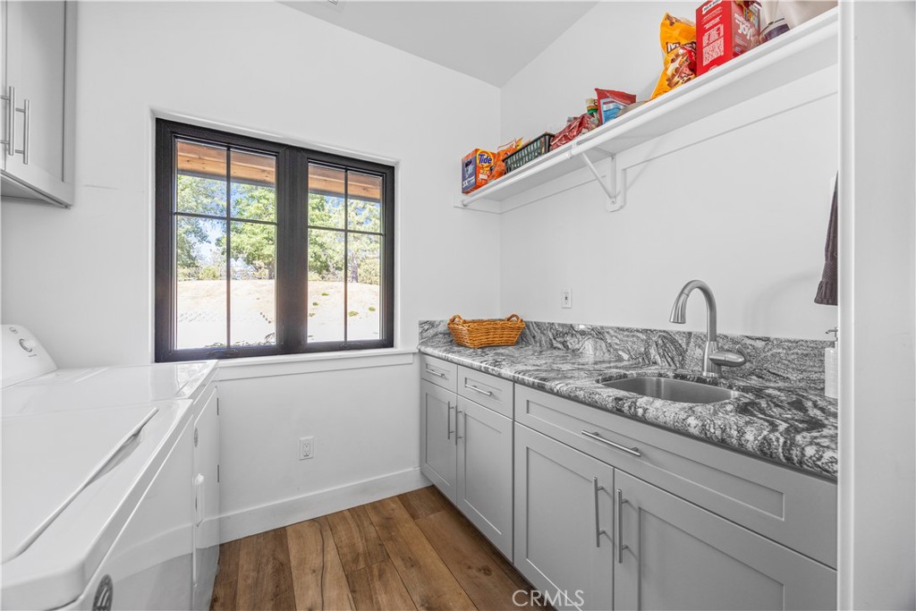 27300 Stirrup Way Tehachapi, CA 93561 - Photo 40 of 45 a kitchen with a sink and a window