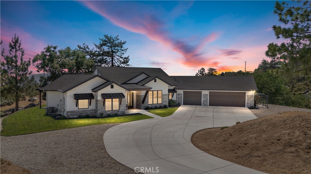 27300 Stirrup Way Tehachapi, CA 93561 - Photo 45 of 45 a front view of a house with a garden and yard