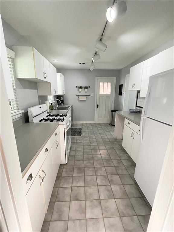 138 Mohawk Drive Pittsburgh, PA 15228 - Photo 4 of 24 a kitchen with granite countertop a stove a sink dishwasher and a refrigerator