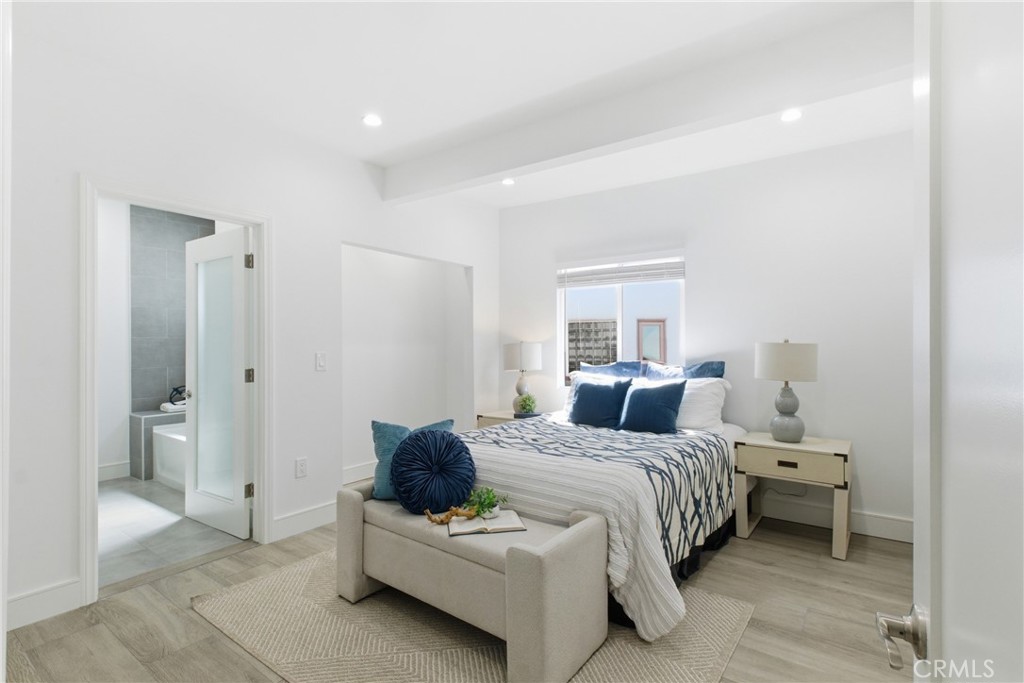 1364 Ridgeley Drive Los Angeles, CA 90019 - Photo 10 of 25 a bedroom with a bed and a couch