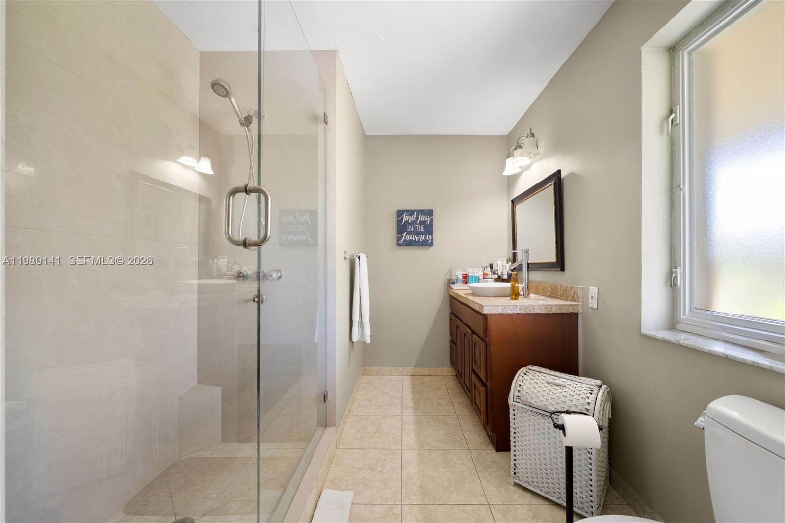 7390 Southwest 114th Street Pinecrest, FL 33156 - Photo 13 of 19 a bathroom with a toilet sink and shower