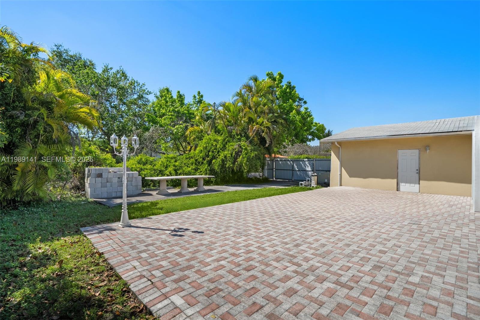 7390 Southwest 114th Street Pinecrest, FL 33156 - Photo 19 of 19 a house view with a backyard space