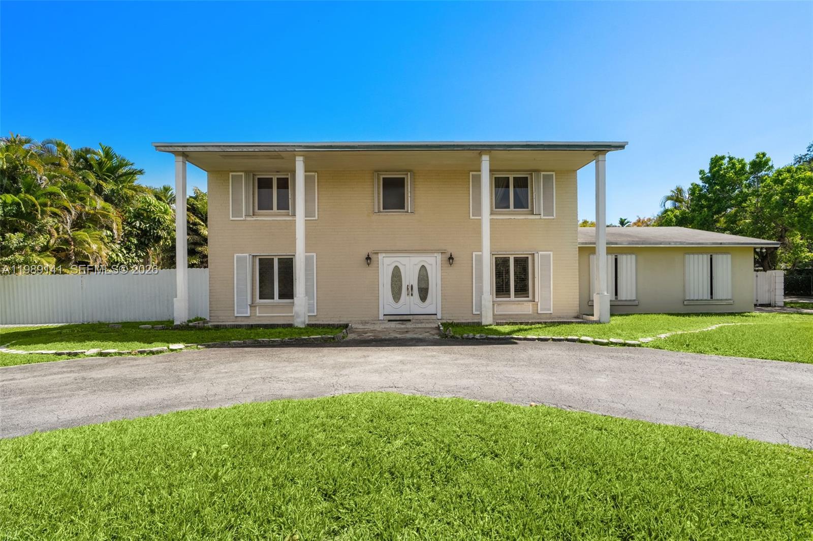 7390 Southwest 114th Street Pinecrest, FL 33156 - Photo 3 of 19 a view of a house with a backyard