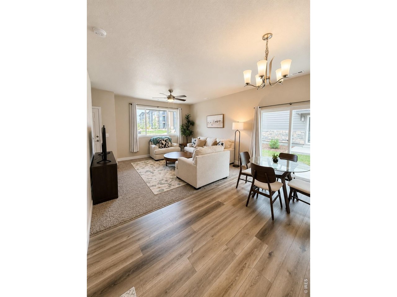 6939 4th St Road, Unit 1 Greeley, CO 80634 - Photo 6 of 30 a living room with furniture and a table