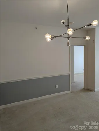 a view of an empty room with a fan
