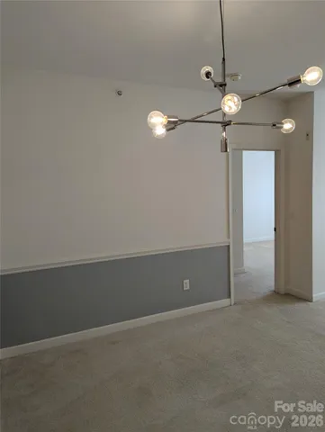 a view of an empty room with a fan