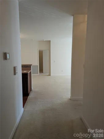 a view of a livingroom with a refrigerator