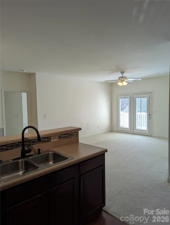 a kitchen with a sink and cabinets