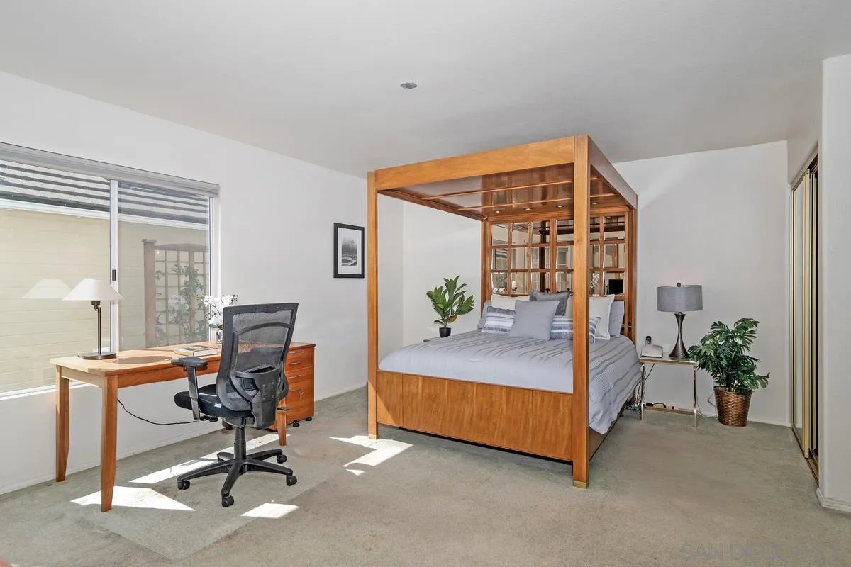 1237 Buttonwood Court El Cajon, CA 92019 - Photo 15 of 45 a bedroom with a bed and a potted plant