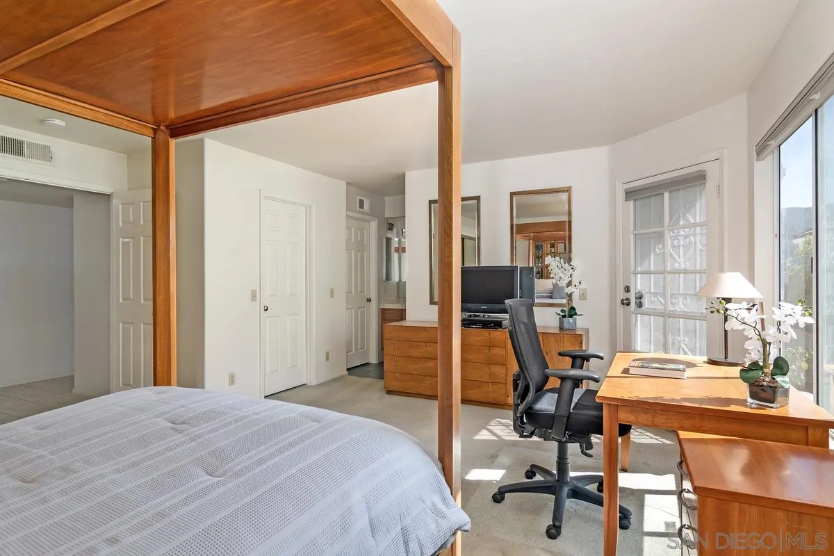 1237 Buttonwood Court El Cajon, CA 92019 - Photo 17 of 45 a bedroom with a bed and wooden floor