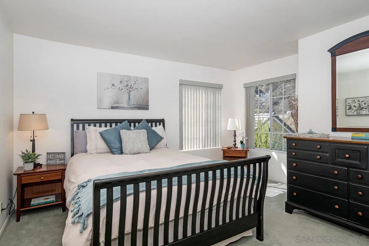 1237 Buttonwood Court El Cajon, CA 92019 - Photo 20 of 45 a bedroom with a bed and a window