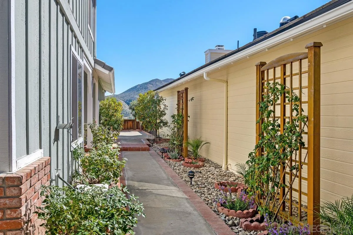 1237 Buttonwood Court El Cajon, CA 92019 - Photo 2 of 45 a view of a pathway with a flower plants