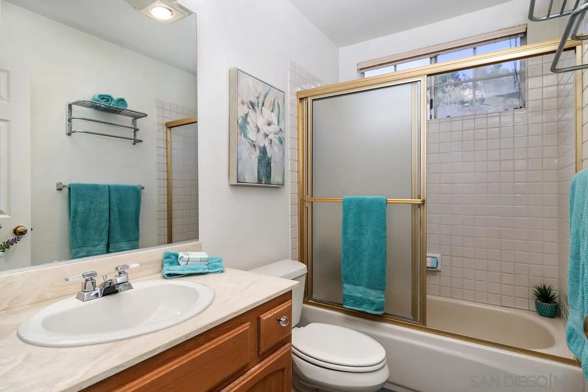 1237 Buttonwood Court El Cajon, CA 92019 - Photo 23 of 45 a bathroom with a sink a toilet and shower