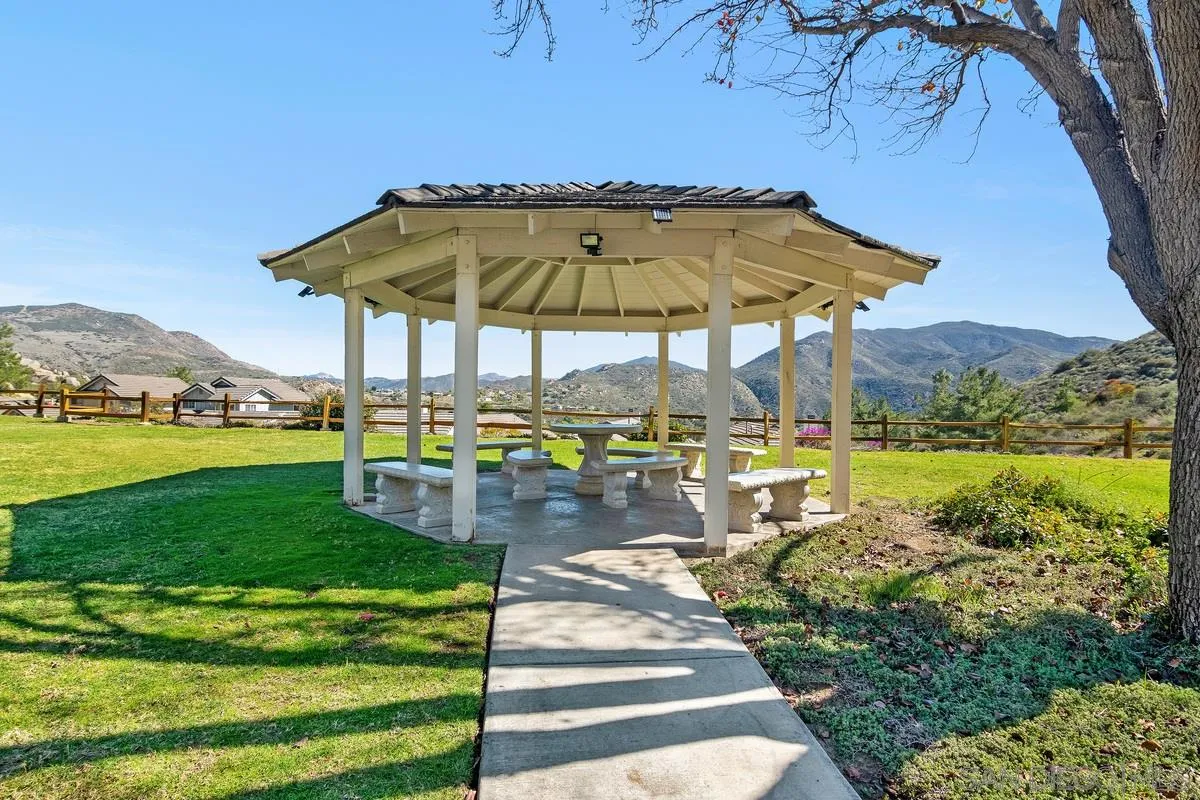 1237 Buttonwood Court El Cajon, CA 92019 - Photo 32 of 45 a view of a swimming pool and lounge chairs in the garden