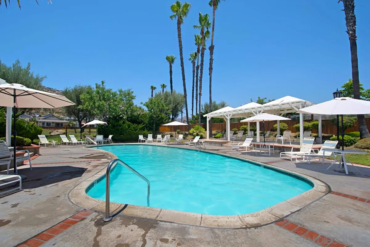1237 Buttonwood Court El Cajon, CA 92019 - Photo 35 of 45 a view of a swimming pool with lounge chairs