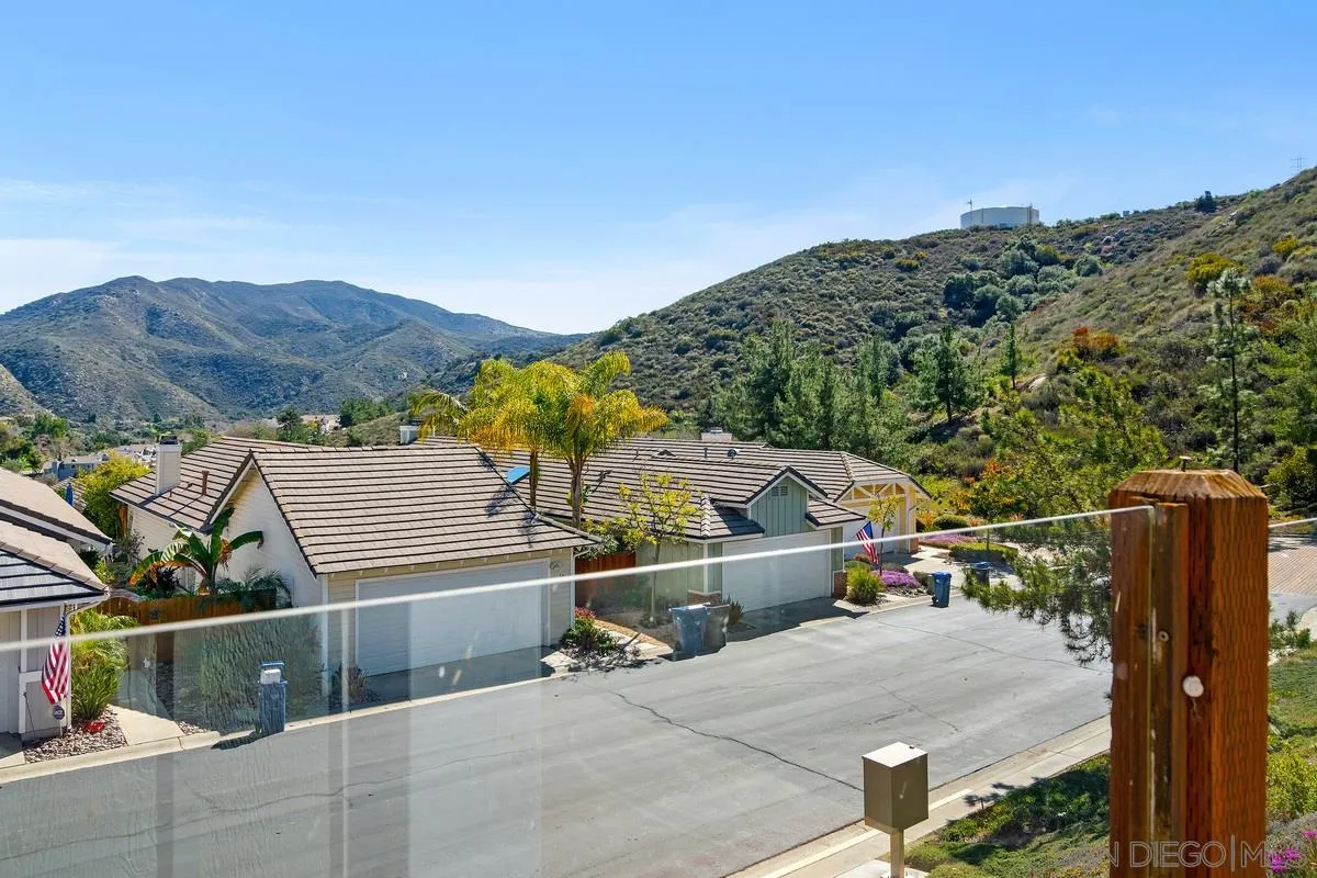 1237 Buttonwood Court El Cajon, CA 92019 - Photo 44 of 45 a view of a terrace with a wooden fence