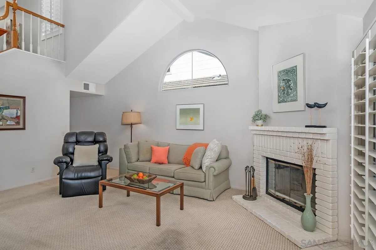 1237 Buttonwood Court El Cajon, CA 92019 - Photo 6 of 45 a living room with furniture a window and a fireplace