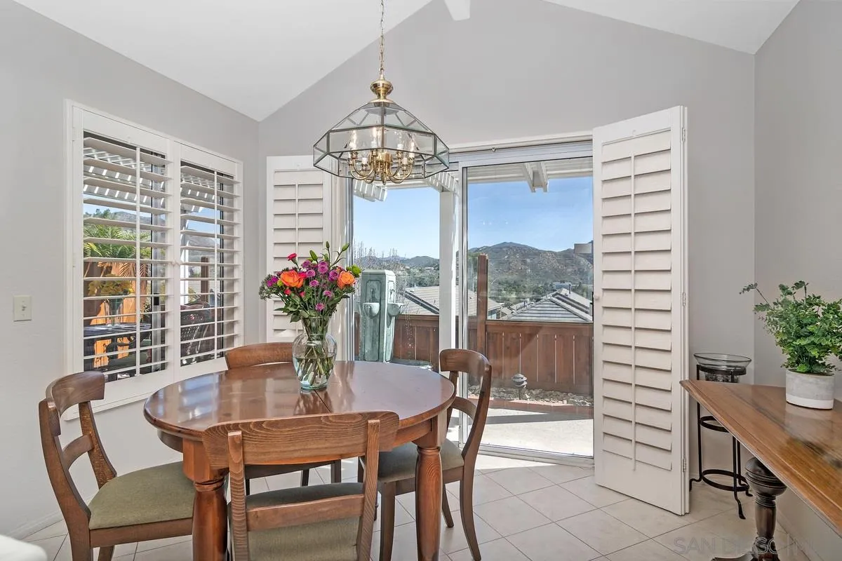 1237 Buttonwood Court El Cajon, CA 92019 - Photo 8 of 45 a dining room with furniture potted plants and wooden floor