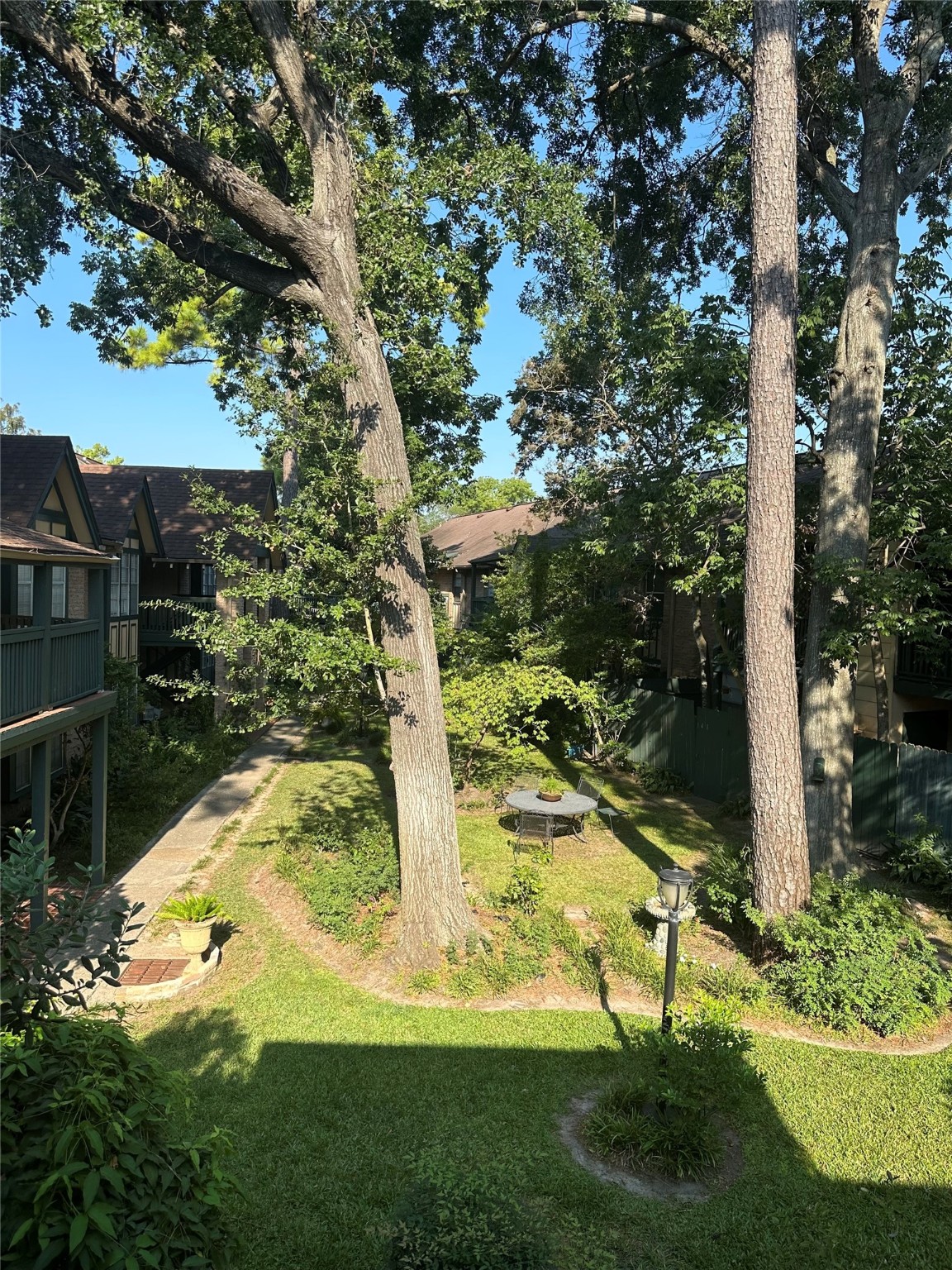 8245 Kingsbrook Road, Unit 236 Houston, TX 77024 - Photo 3 of 14 a view of a yard in front of house