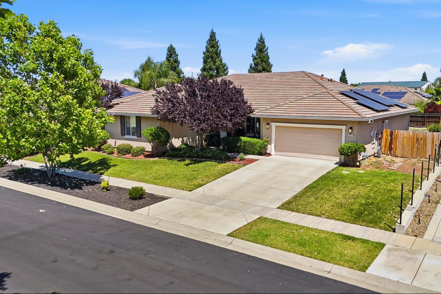 2011 Roy Ranch Way Plumas Lake, CA 95961 - Photo 2 of 49 a front view of a house with a yard and potted plants