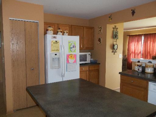6508 Roth Drive Joliet, IL 60431 - Photo 4 of 14 a kitchen with refrigerator and window