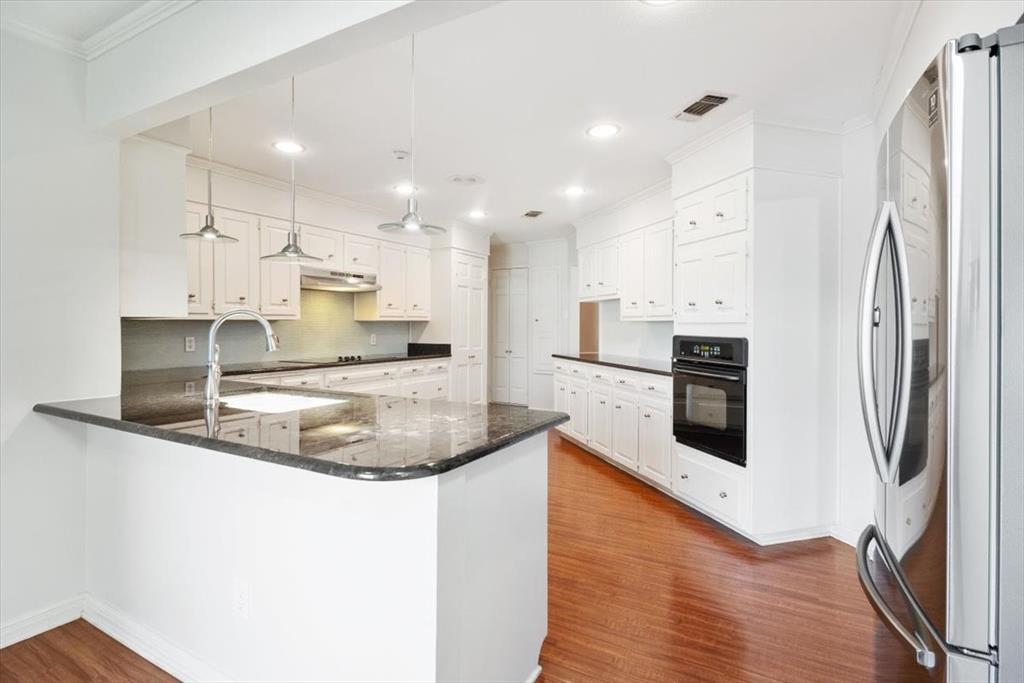 3410 Timbermill Road Waco, TX 76710 - Photo 11 of 32 a kitchen with stainless steel appliances granite countertop a refrigerator a sink a stove and oven