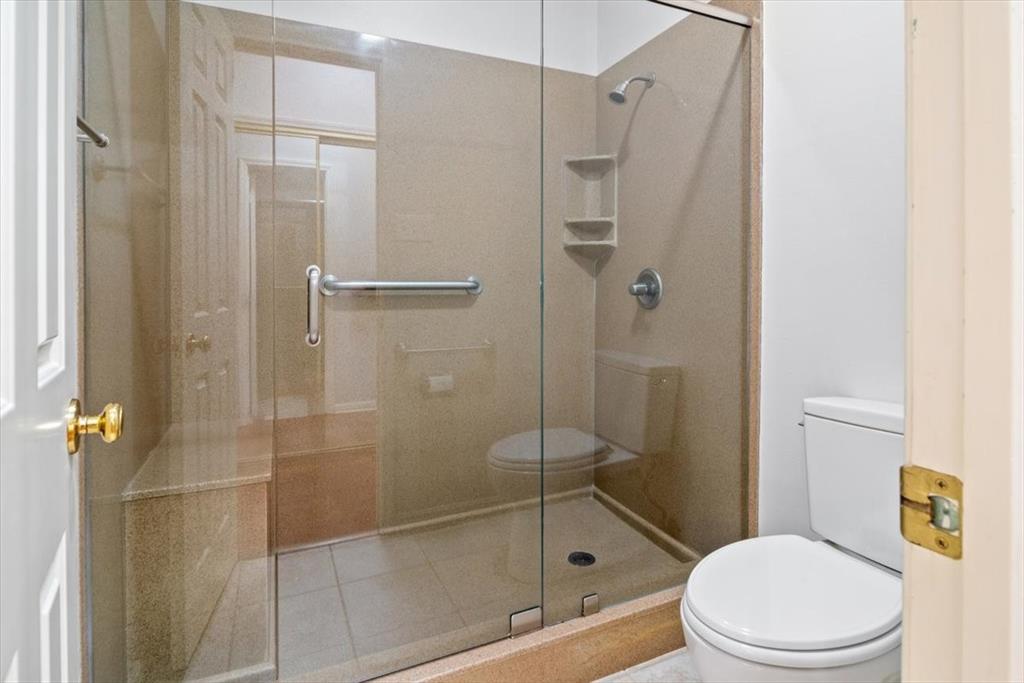 3410 Timbermill Road Waco, TX 76710 - Photo 19 of 32 a white toilet next to a bathroom