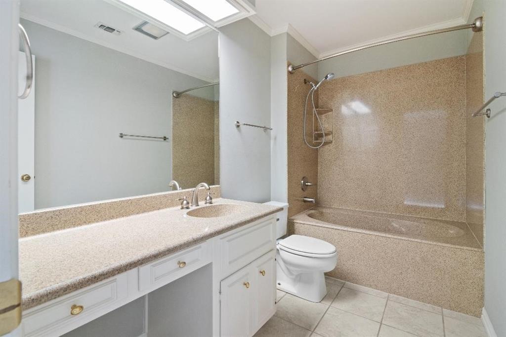 3410 Timbermill Road Waco, TX 76710 - Photo 22 of 32 a bathroom with a granite countertop sink a toilet and shower
