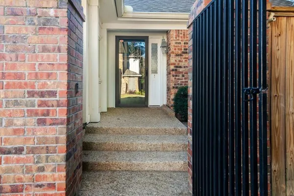 a view of a brick house with a windows