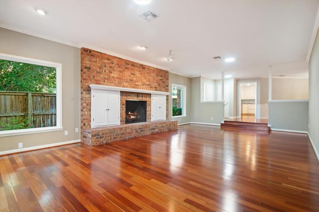 3410 Timbermill Road Waco, TX 76710 - Photo 5 of 32 a view of empty room with wooden floor and fireplace