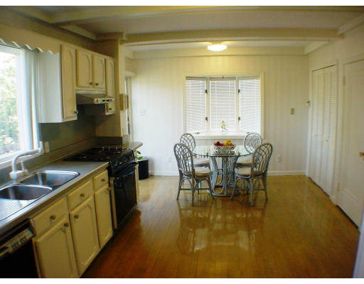 27 Standish Road Watertown, MA 02472 - Photo 8 of 10 a kitchen with a table chairs and a window