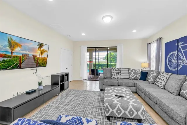 a living room with furniture and a flat screen tv