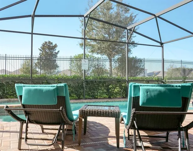 a view of a chairs and table on the deck
