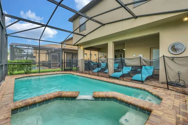 a backyard with table and chairs