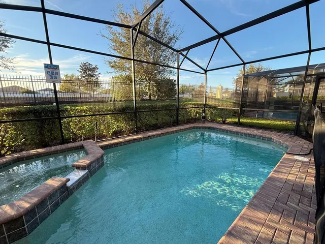 a view of a swimming pool with a patio
