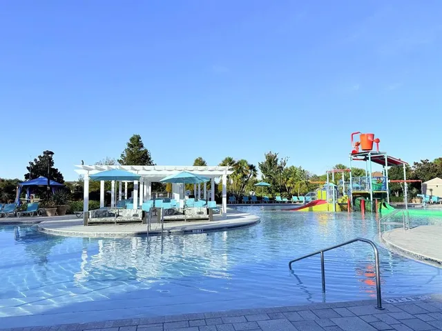 a view of a swimming pool with outdoor seating